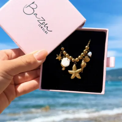 Sun-kissed days, salty air, and a golden shell necklace to carry a piece of the ocean wherever you go. ✨🌊🐚

#waterproofjewelry #summerjewelry☀️ #jewelrybrand #bazou
